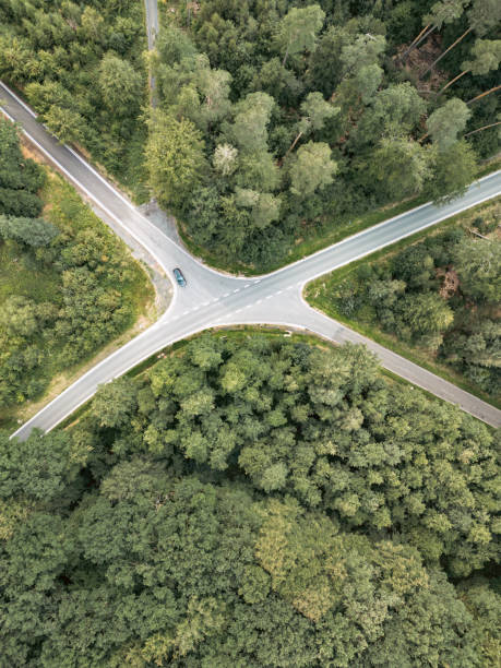 Aerial view of a intersection in the forest, shaped like an X