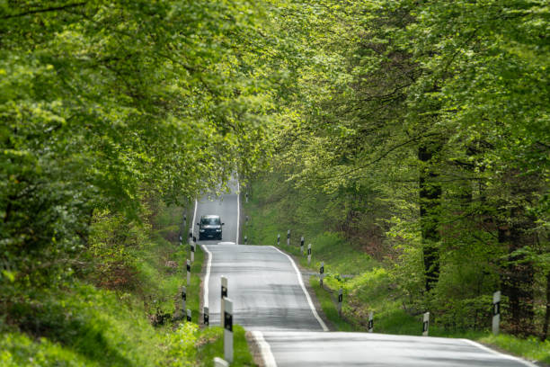istock Small asphalt road going up and down 2155892869