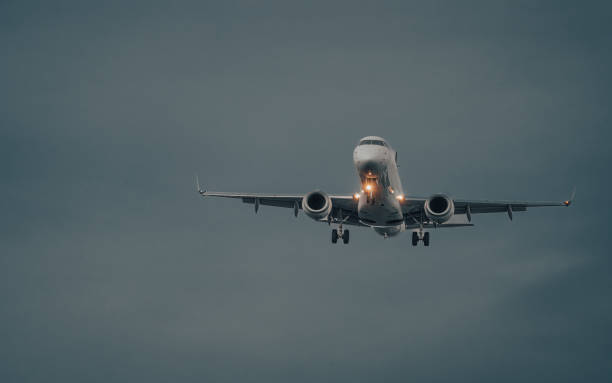 istock Airplane taking off in front of the dark clouds 2155892874