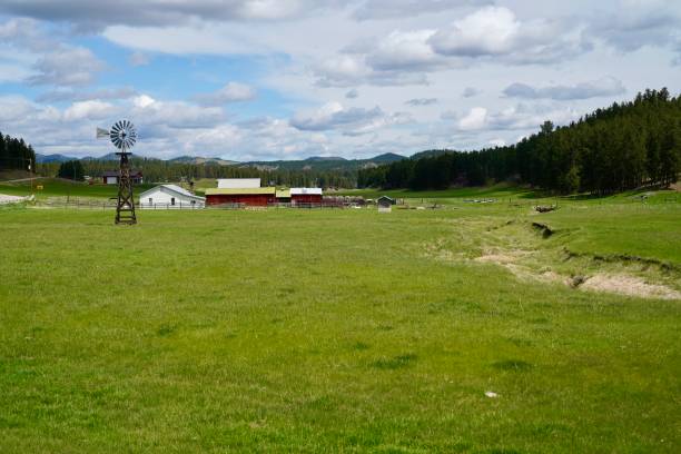 istock the farm is surrounded by mountains and blue skies with clouds 2155894489