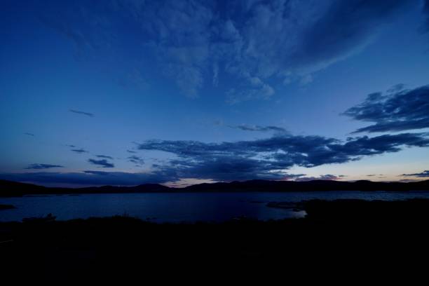 istock there is a lake under a sky with clouds in the background 2155894529