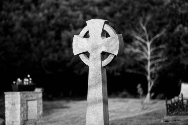 istock Celtic cross in Cambridgeshire park, in grayscale 2155894681