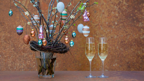 istock Rusty easter decorated brunches with champagne glasses 2155895357