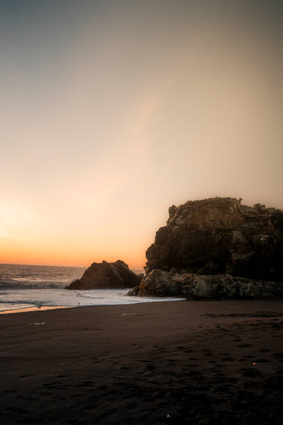 istock Rocky beach at sunset with colorful sky 2155895610