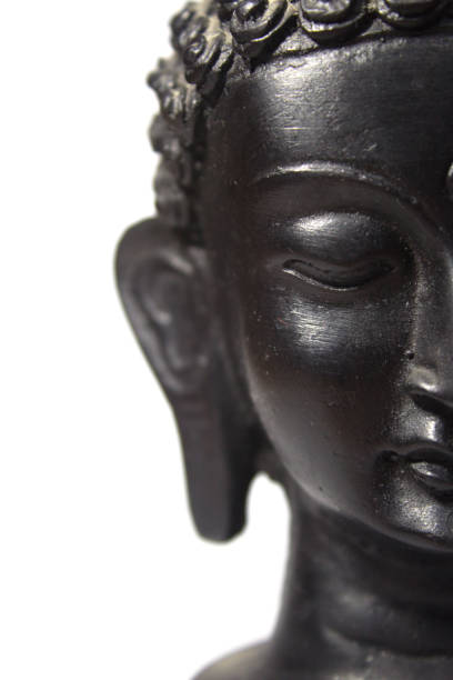 istock Dark-hued Buddha statue captured in this image 2155895677