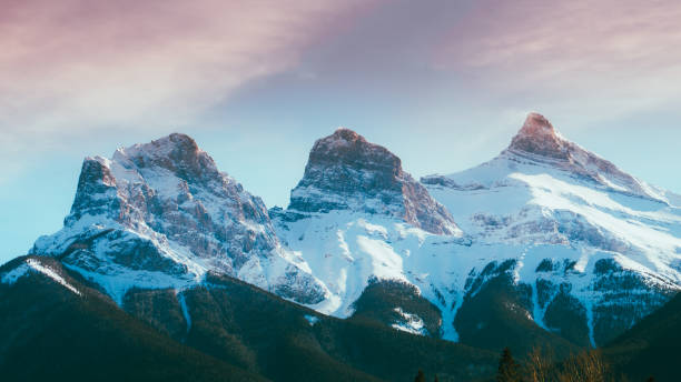 istock Sunset behind the Three Sisters mountains, Alberta, Canada 2155895946