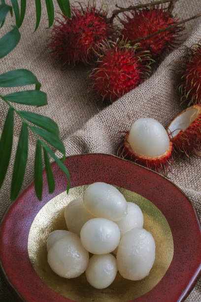 istock Top view of Rambutan fruit and leaves on fabric 2155897820