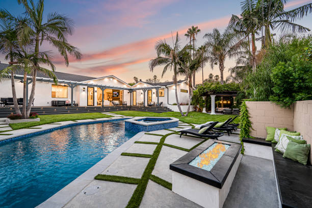 istock Spacious backyard pool with palm trees in a modern new construction home in Los Angeles 2155899774