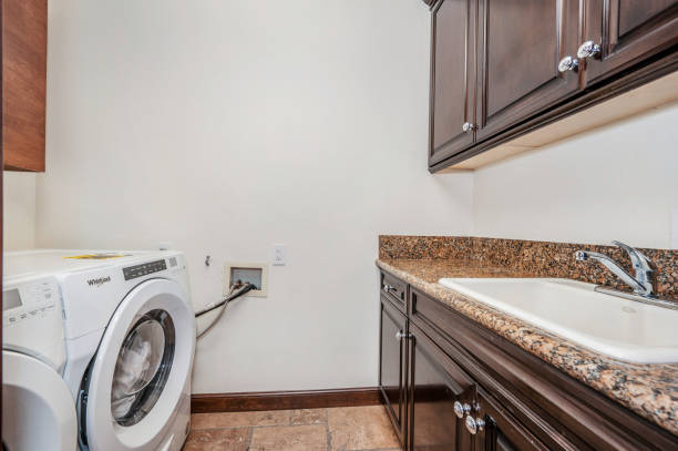 istock a washer and dryer are sitting in a room 2155900546