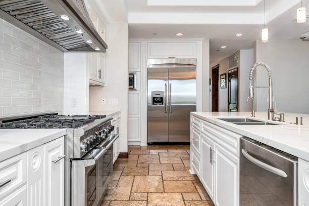 istock a large modern white kitchen with tiled flooring and stainless steel appliances 2155900552