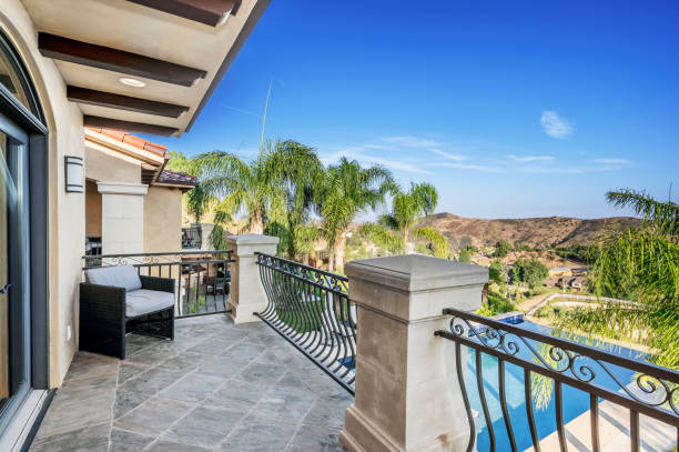 istock view from balcony with pool, table and chairs and fence 2155900717