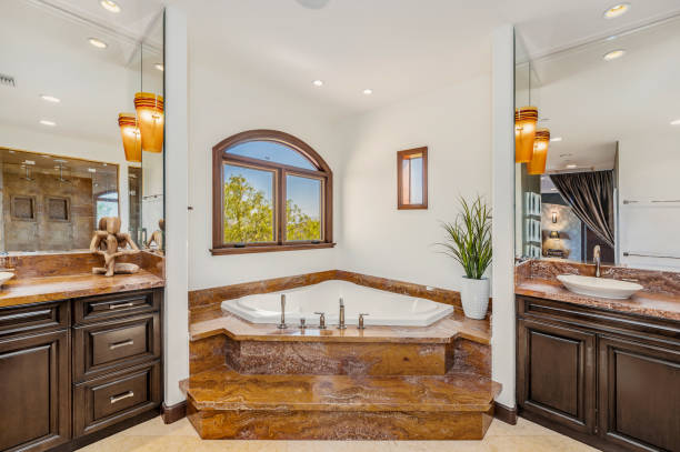istock a large master bath tub in a bathroom near a sink 2155900749