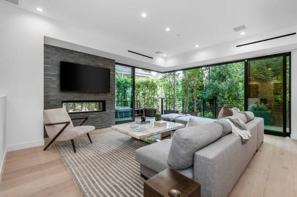 istock a living room with large couches, coffee table, and fireplace 2155900876