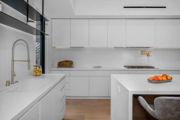istock a white kitchen with a sink and some oranges on the counter 2155900953