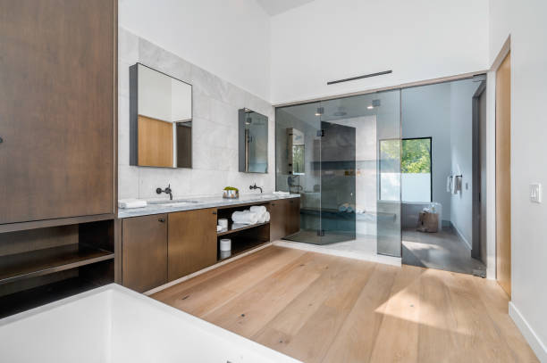 istock a bathroom with a walk - in shower and double sinks 2155901063