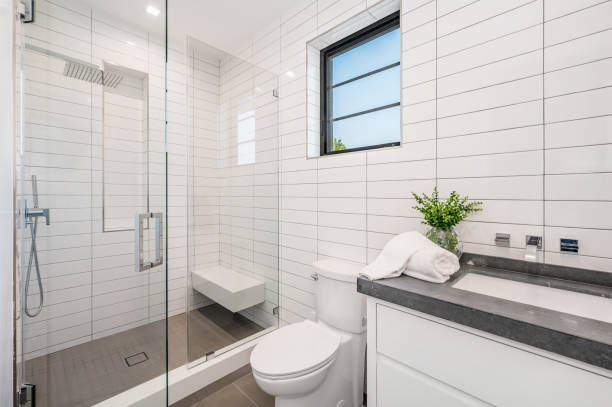 istock a bathroom with tile and a white toilet and bathtub 2155901205