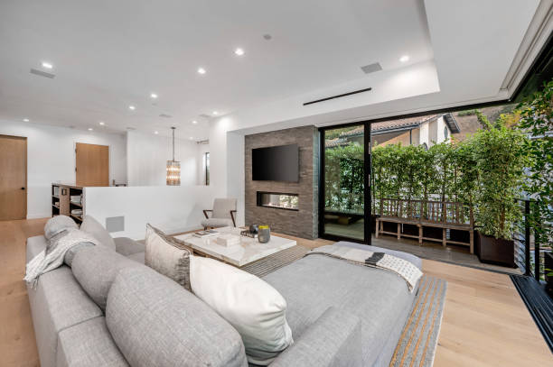 istock a living room with a big couch and many tables inside 2155901323