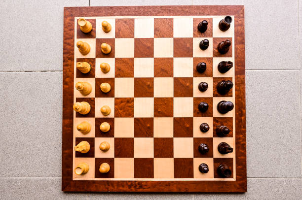 istock A wooden chess board with black and white pieces 2155901331