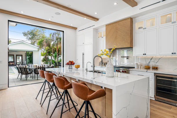istock the kitchen is bright and modern in this home design featuring the high - backed bars 2155901340