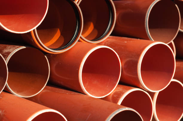 A closeup of some sewage pipes on a construction site