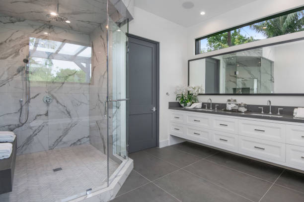 istock a bathroom with marble tile and double vanity tops and sinks 2155901460