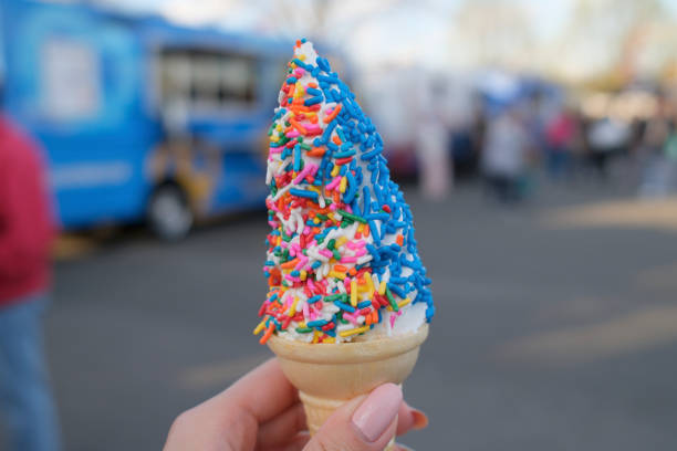 istock Person holding a blue and white ice cream cone 2155901486