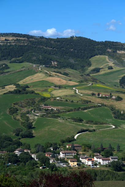istock country road climbing up a hill 2155901714