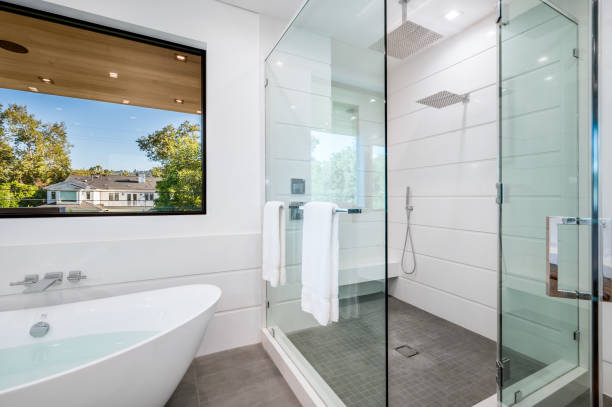 a bathroom with a sink and walk - in shower is shown