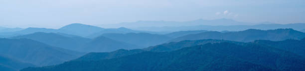 istock Beautiful dark blue mountain landscape in fog. Horizontal panorama. 2155901908