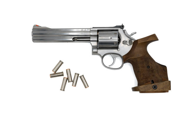 istock 357 Magnum caliber revolver with an anatomical precision grip and .38 Special caliber bullets 2155901930
