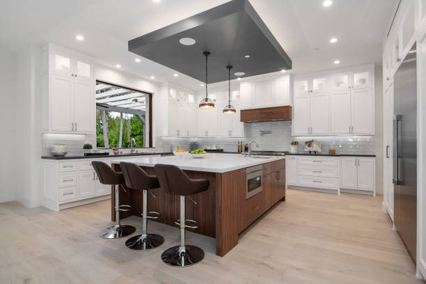 istock a kitchen with two bar stools next to a marble countertop 2155902350