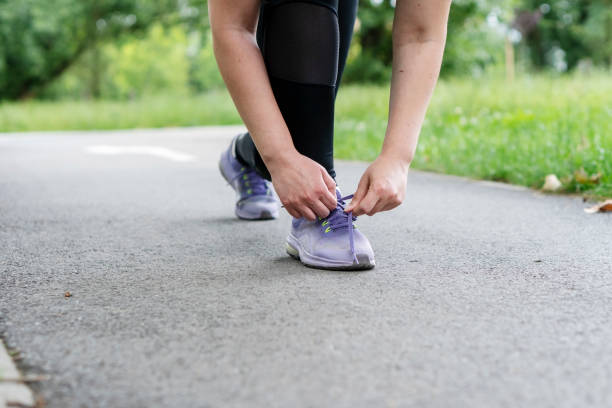istock Young   woman doing physical exercises outdoors 2155902941