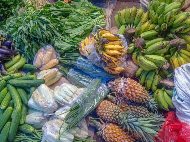 Tropical fruit on display. Pineapple, banana, lychee.