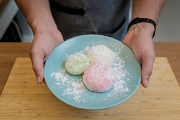 istock Different color delicious Japanese mochi on the blue plate 2155904334