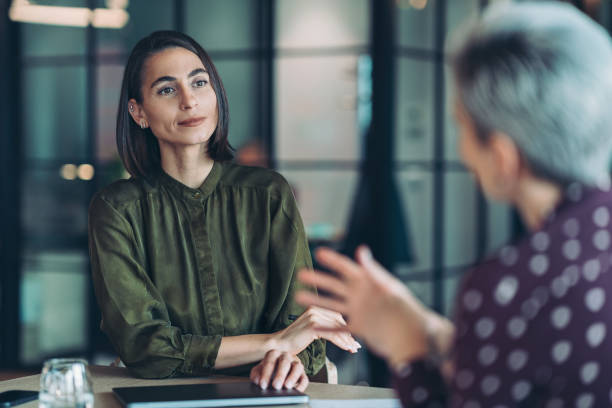 istock Focus on a female entrepreneur during a meeting 2155904772