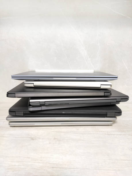 istock stack of laptops on a gray background, on the table, laptop computer, tablet, business, work, remote work, freelance. 2155906175