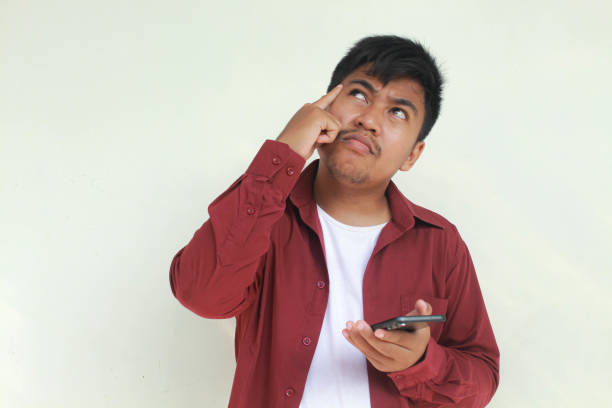 istock Asian young man with curious face emotion. 2155906481