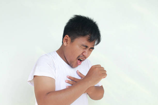Sick Young asian man is flu and cough. Illness, influenza, pain concept. Healthcare and Corona Concepts.