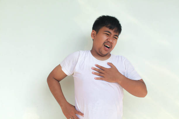 istock Tired upset young man suffering from pain, muscle spasm at workplace. 2155908264