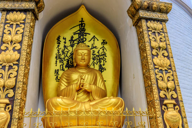 Ancient Buddha statue wearing a cerimonial robe at Wihan Phra Mongkhon Bophit temple. Ayutthaya. Phra Nakhon Si Ayutthaya province. Thailand.