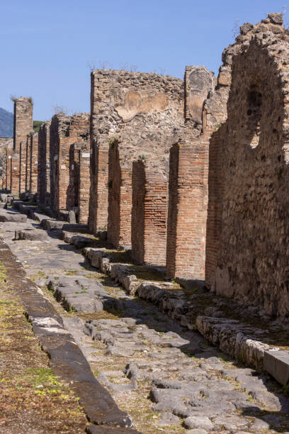 istock Pompeii cobblestone street with ruins 2155908698