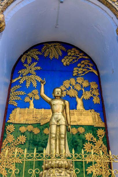 Majestic Golden Buddha Statues Against a Clear Blue Sky
