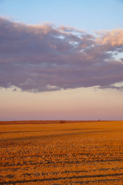 istock The image captures rocks on ground with clouds in the distant sky. 2155909347