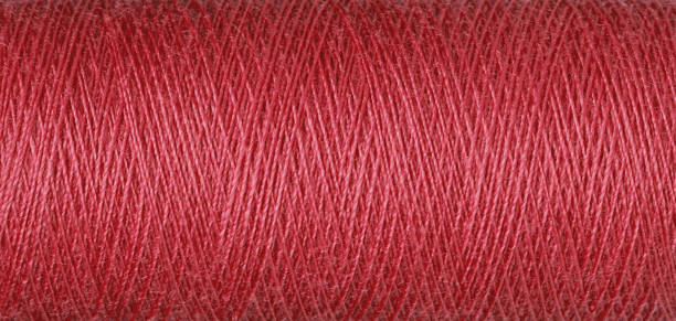 istock macro texture of a skein of red sewing thread 2155909873