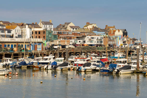 Bridlington, North Yorkshire, England - June 02, 2024:  Boats in the harbour on a sunny day.