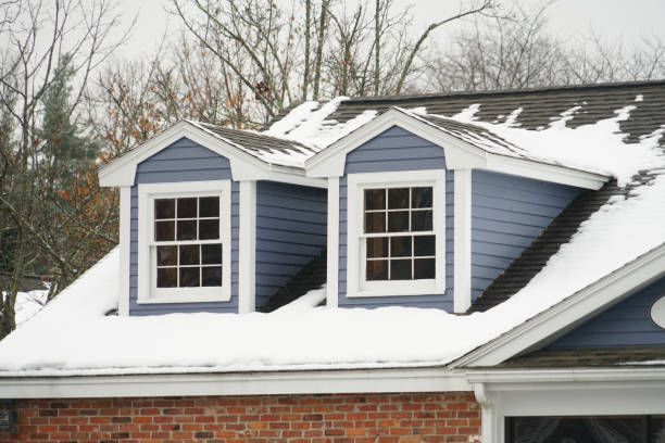 istock close up on ancient house attic with snow 2155911611