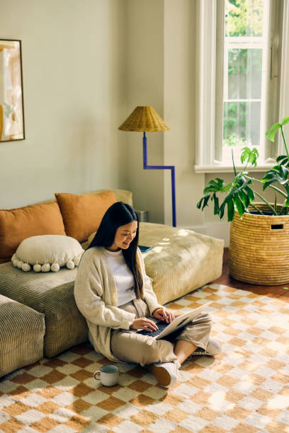 istock Young Asian self-employed female working from home. Remote work and productivity concept. 2155915938