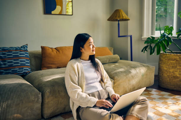istock Young Asian self-employed female working from home. Remote work and productivity concept. 2155915978