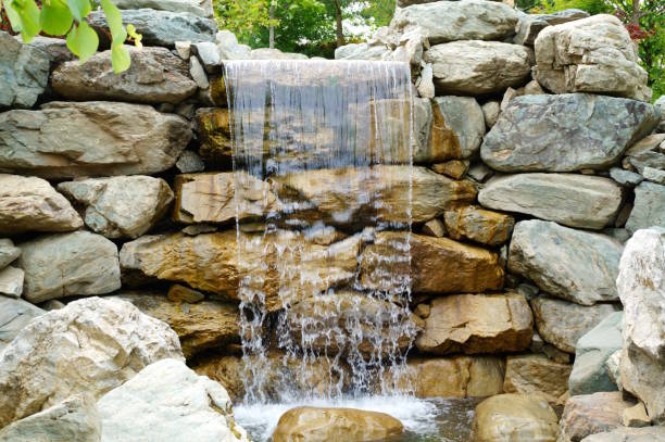 istock A small waterfall in a Japanese garden. Parks and nature. 2155916946