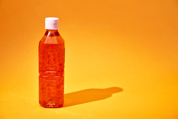 istock Iced Tea in Recycled PET Plastic Bottle on Yellow Background 2155917295